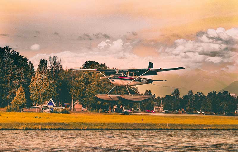 Seaplane in the air over a body of water