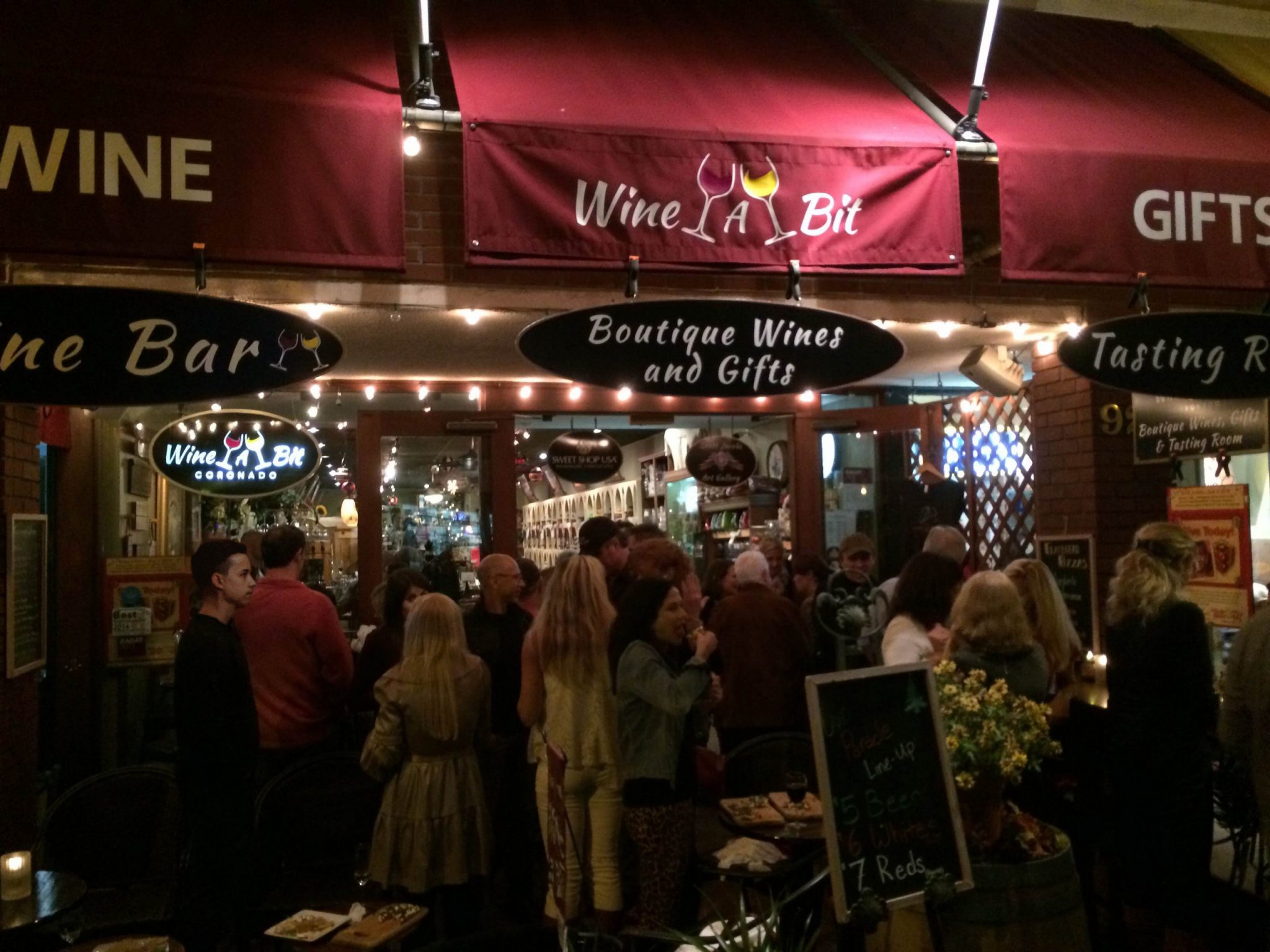 Large crowd outside of the Wine A Bit Storefront