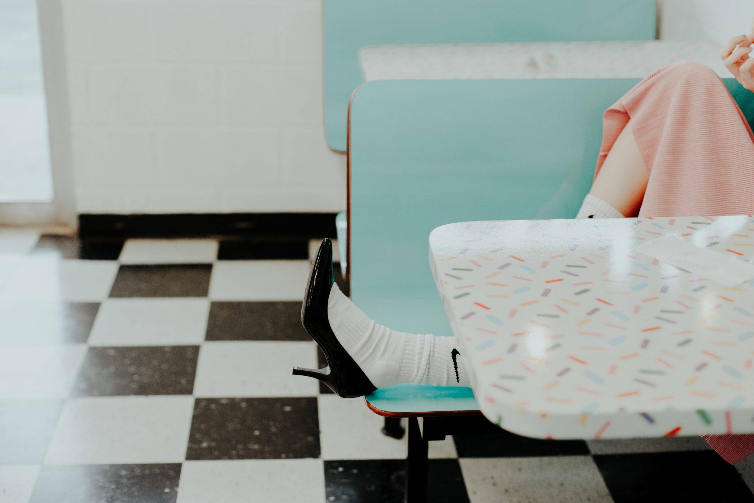 Someone sitting in a diner booth