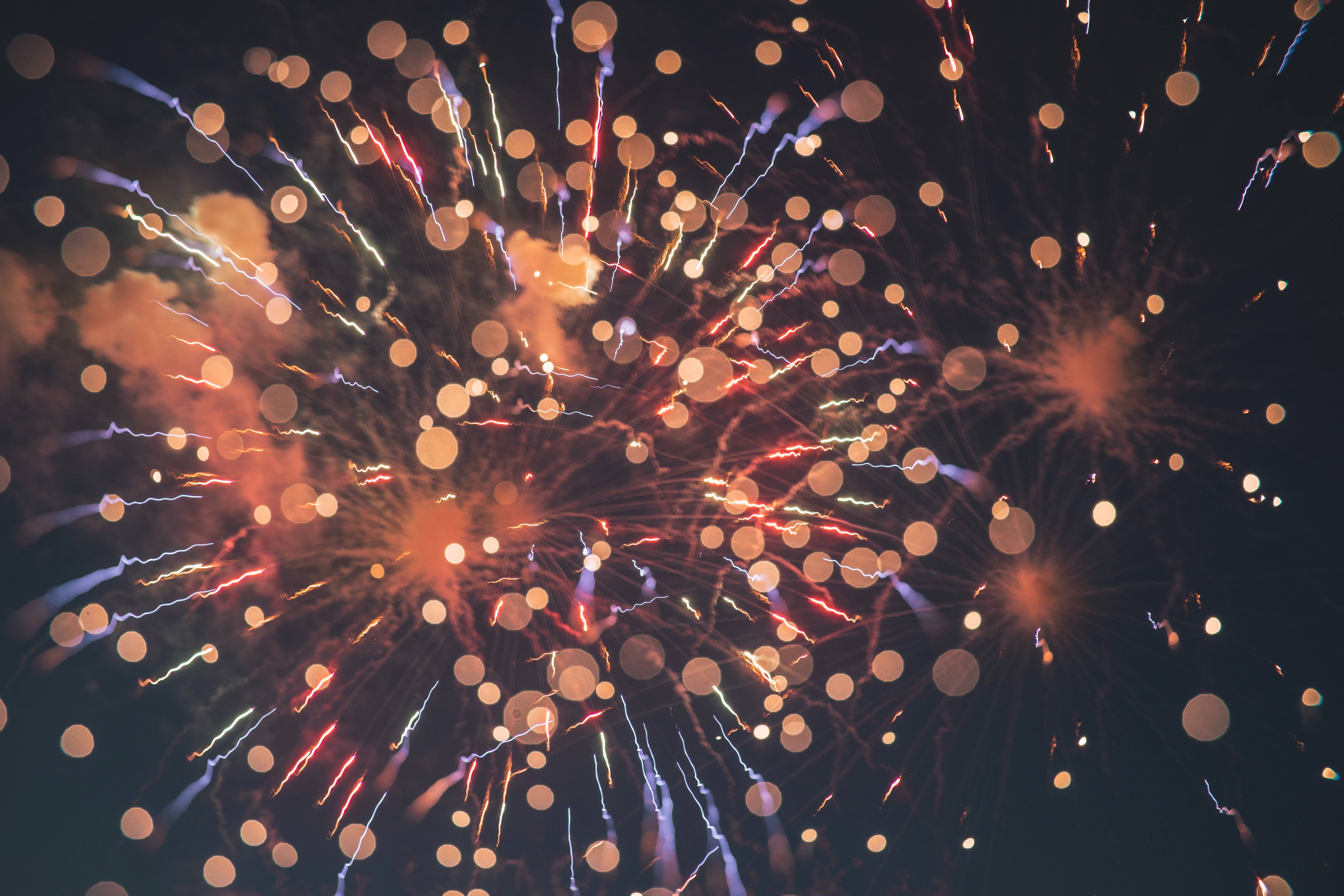 Fireworks Flashes of Lights Red and White Over Hotel Del Coronado Beachfront