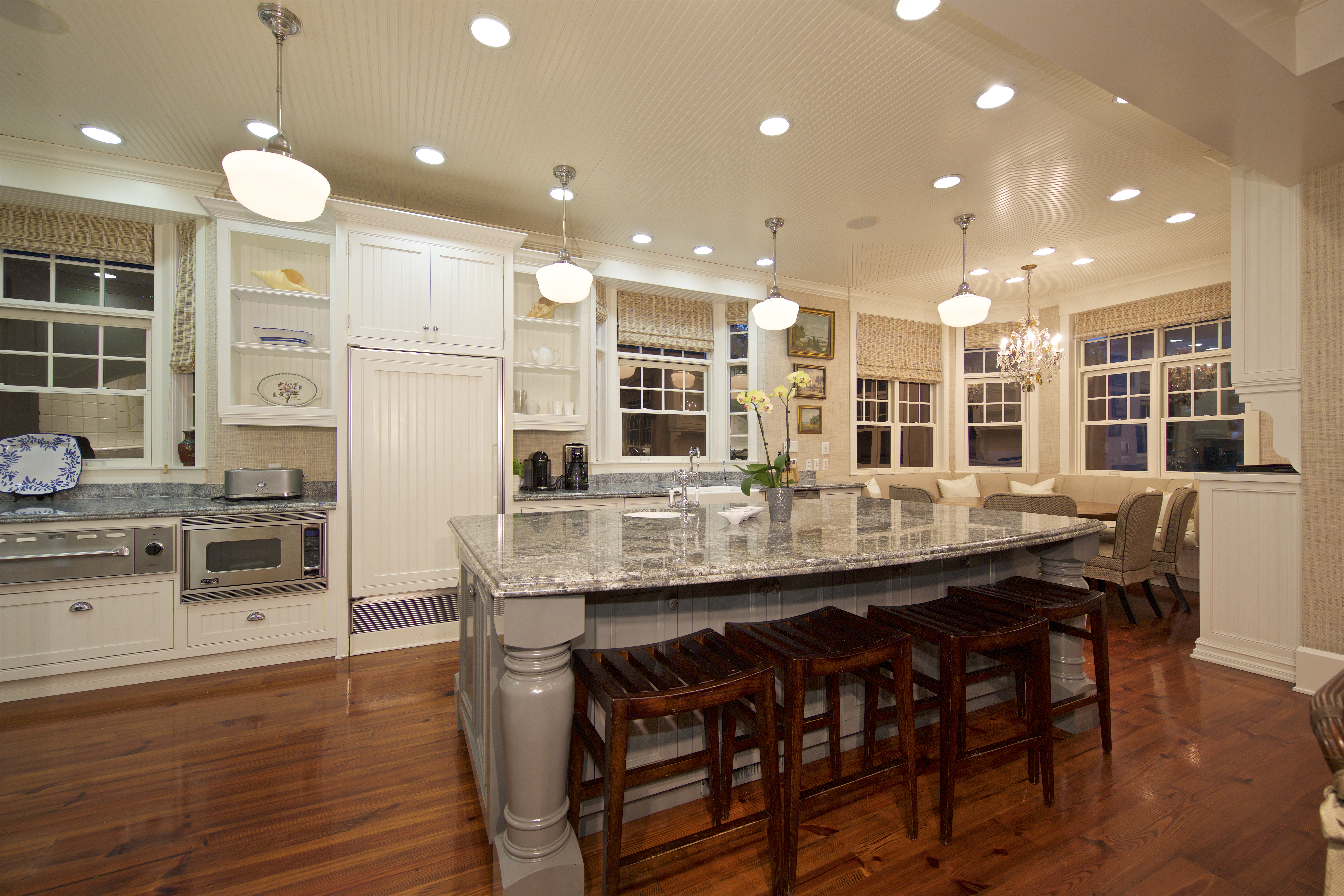 Luxurious kitchen in Coronado home for sale, featuring granite island and bar seating