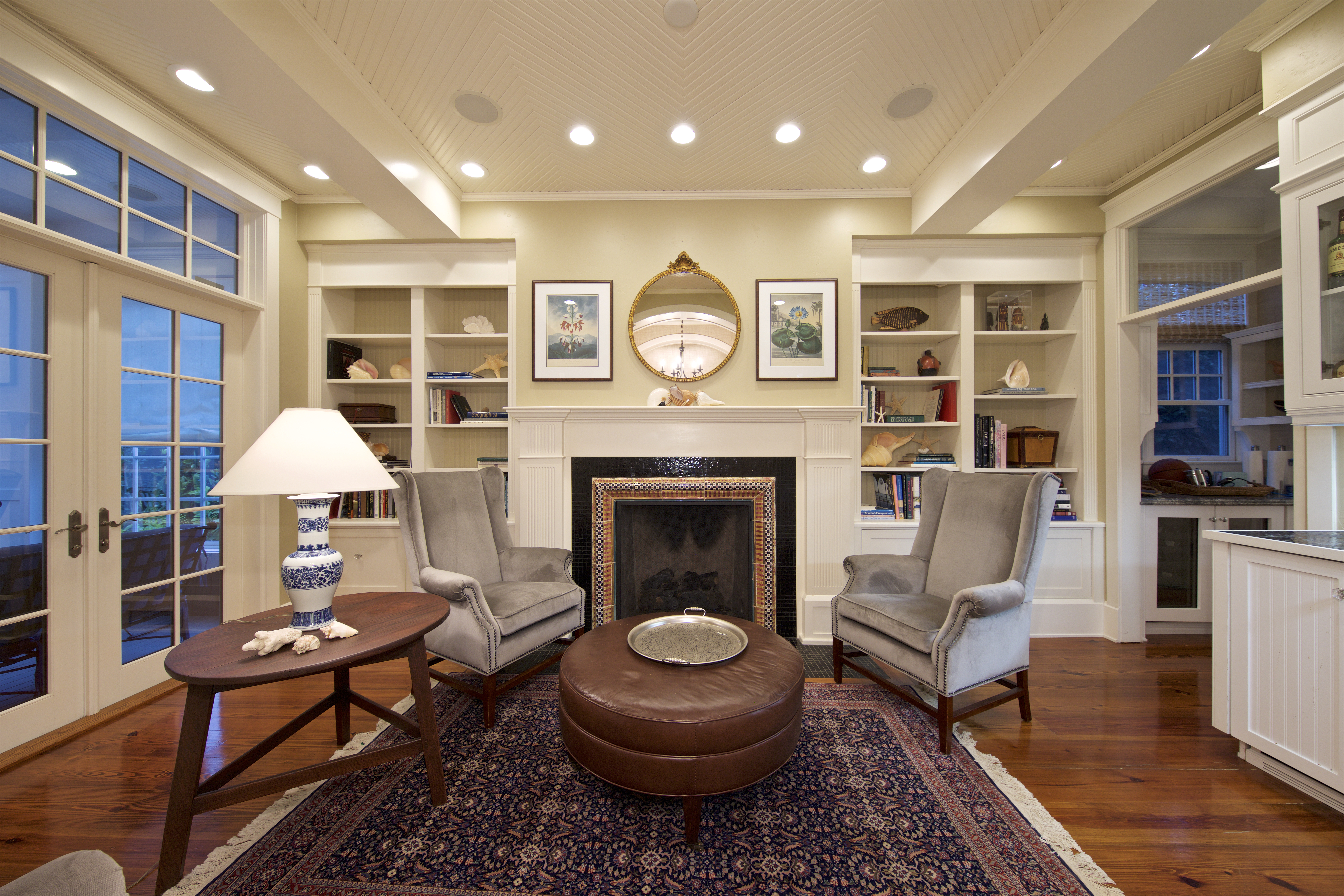 Traditional living room in Coronado home, with fireplace and built-in bookshelves