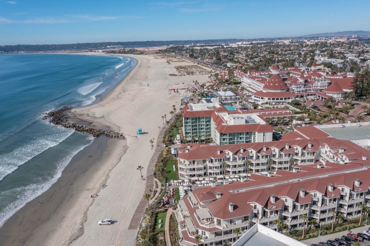 The Shore House condominium complex on the Coronado beachfront with palm trees and ocean views