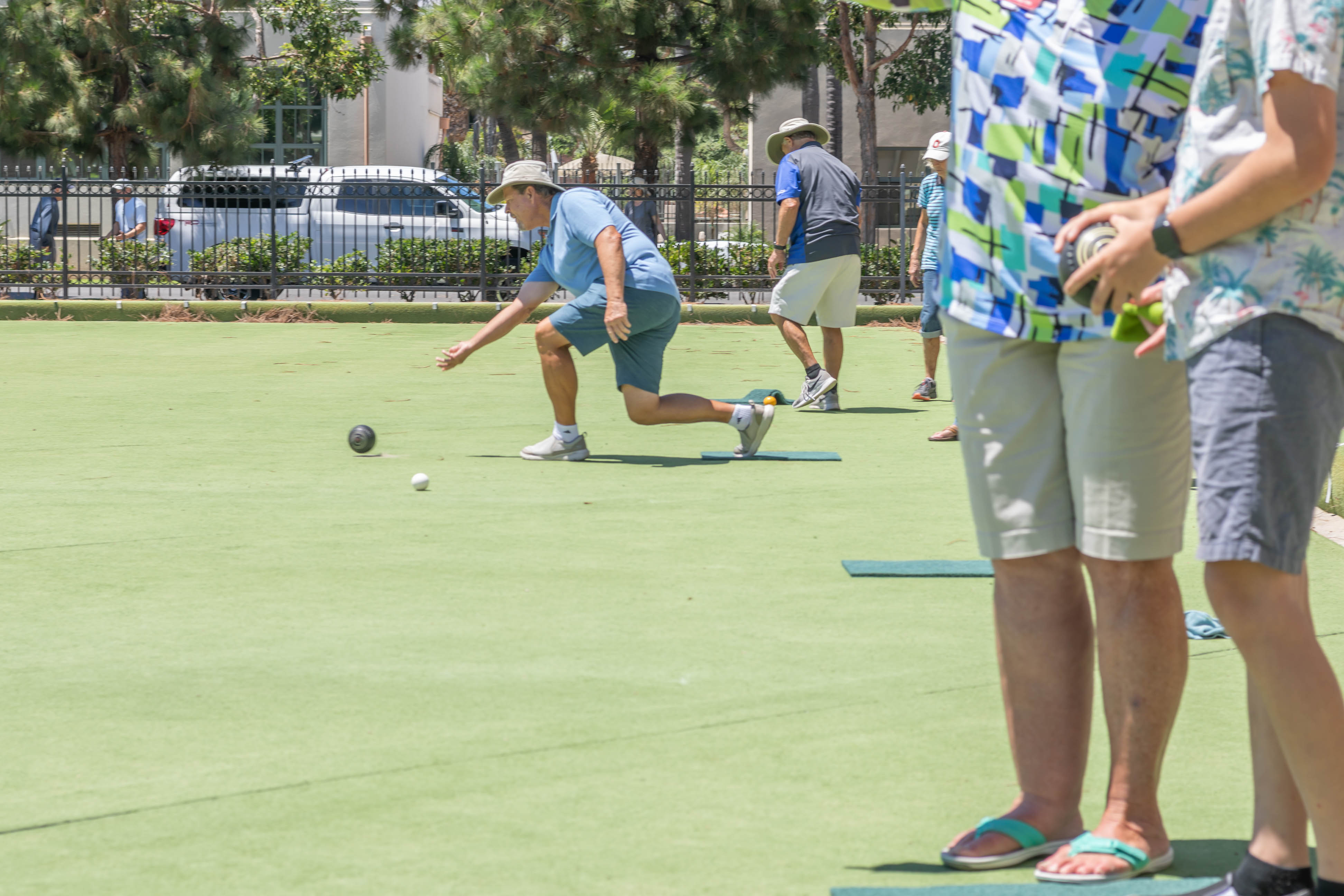 The meticulously maintained lawn bowling green at Spreckels Park in Coronado, located next to the public library. Players enjoy a match on the expansive green lawn.