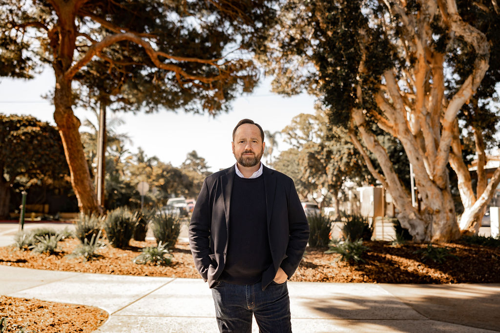 Whitney Benzian, top Coronado real estate agent, standing in a local park