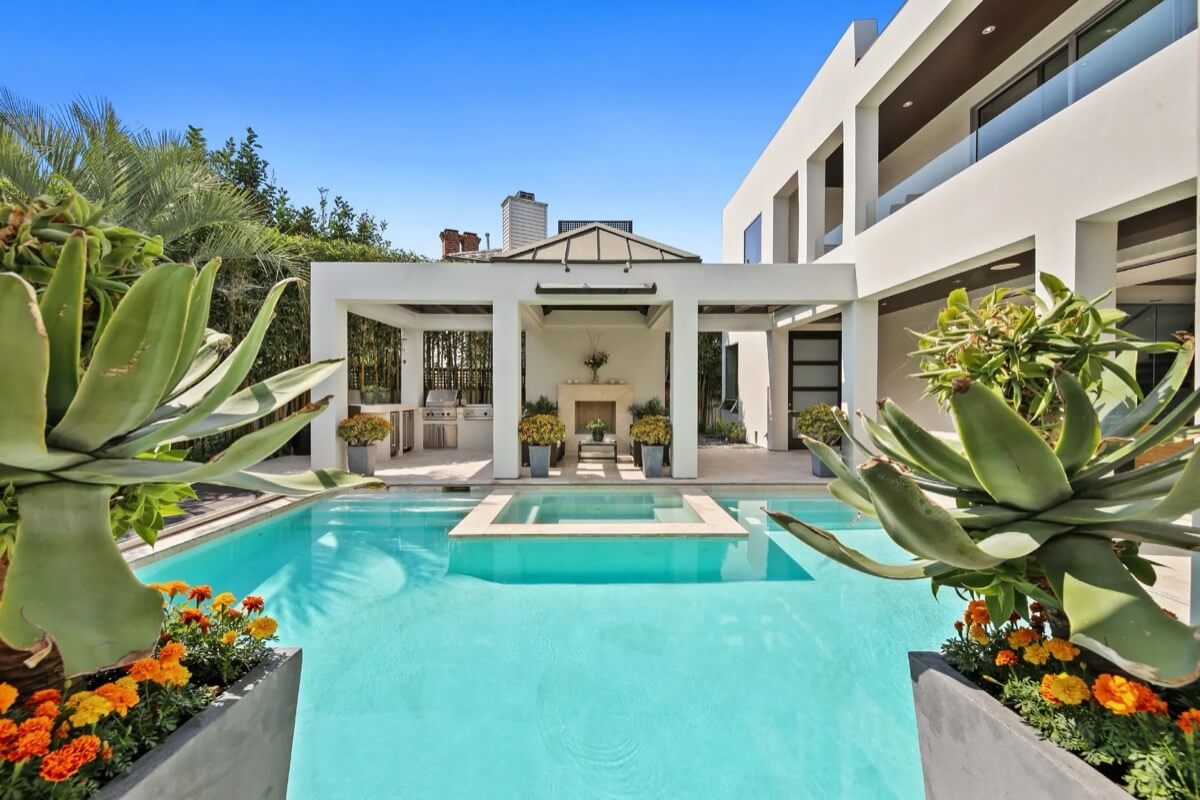 Backyard pool and California room of luxury real estate listing sold by the best Coronado realtor Whitney Benzian.