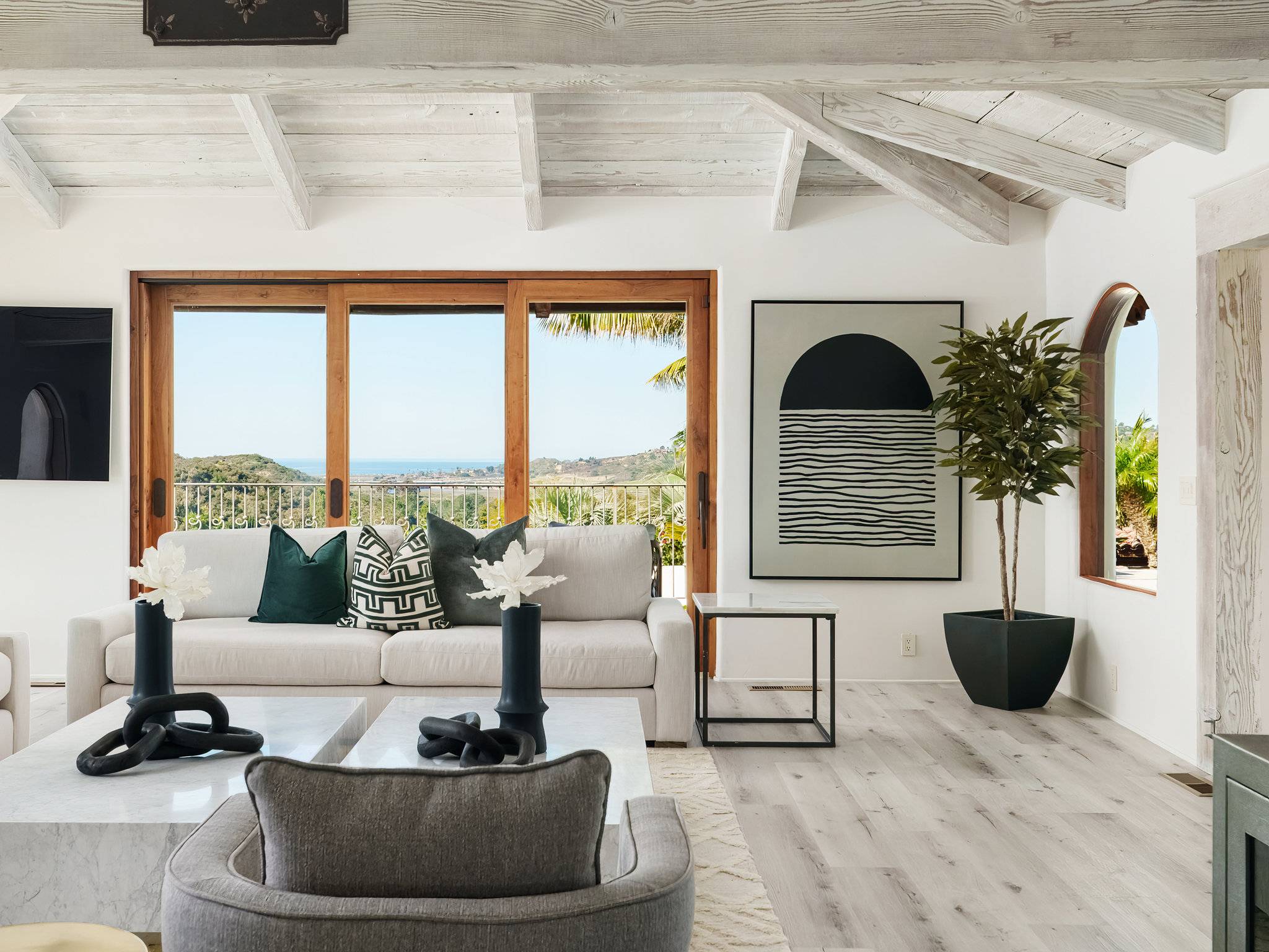 Luxury home for sale living room showcasing a simple black and white painting for staging seller working with top Coronado Realtor agent Whitney Benzian