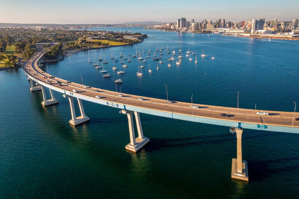 View of Coronado Bridge for comparison of La Jolla real estate and lifestyle for homebuyers with top realtor agents in San Diego Whitney Benzian
