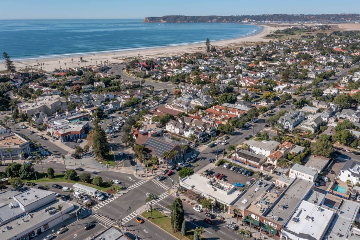 Aerial view of Coronado homes and the beach where real estate closing costs are significant