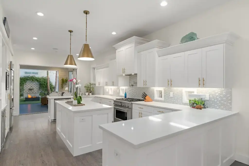 Chic all-white luxury kitchen for homebuyers and mortgage financing and loan types in Coronado by top real estate agents