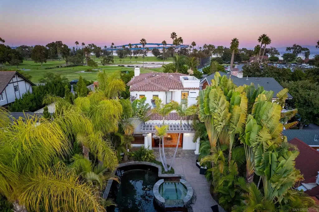 Aerial view of luxury real estate and the bridge beyond, representing strategies for selling your Coronado home including public listing on the MLS and a private off-market sale
