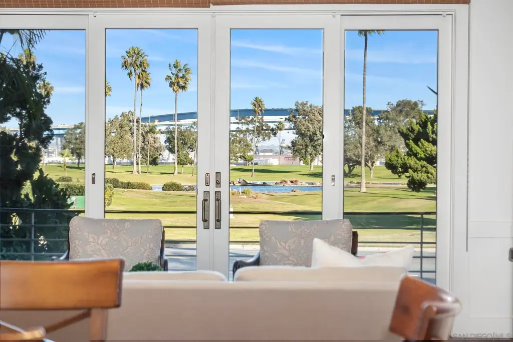 Interior dining room overlooking the Coronado golf course at a luxury home sold by the best local Realtors on the island