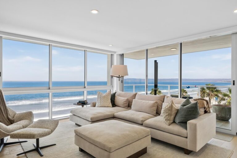 Living room with ocean views at a condo above the beach, where the best local Realtor Whitney Benzian helps sellers pricing your Coronado home for sale with expert real estate agent advice.